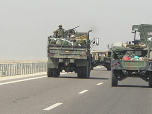 Rolling deep and armed on a convoy in Iraq. Photo credit: Cori Wilkerson